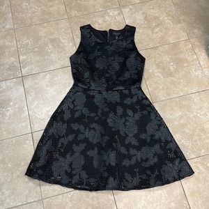 Black cocktail dress. Very unique black on black flowering. Size extra small.